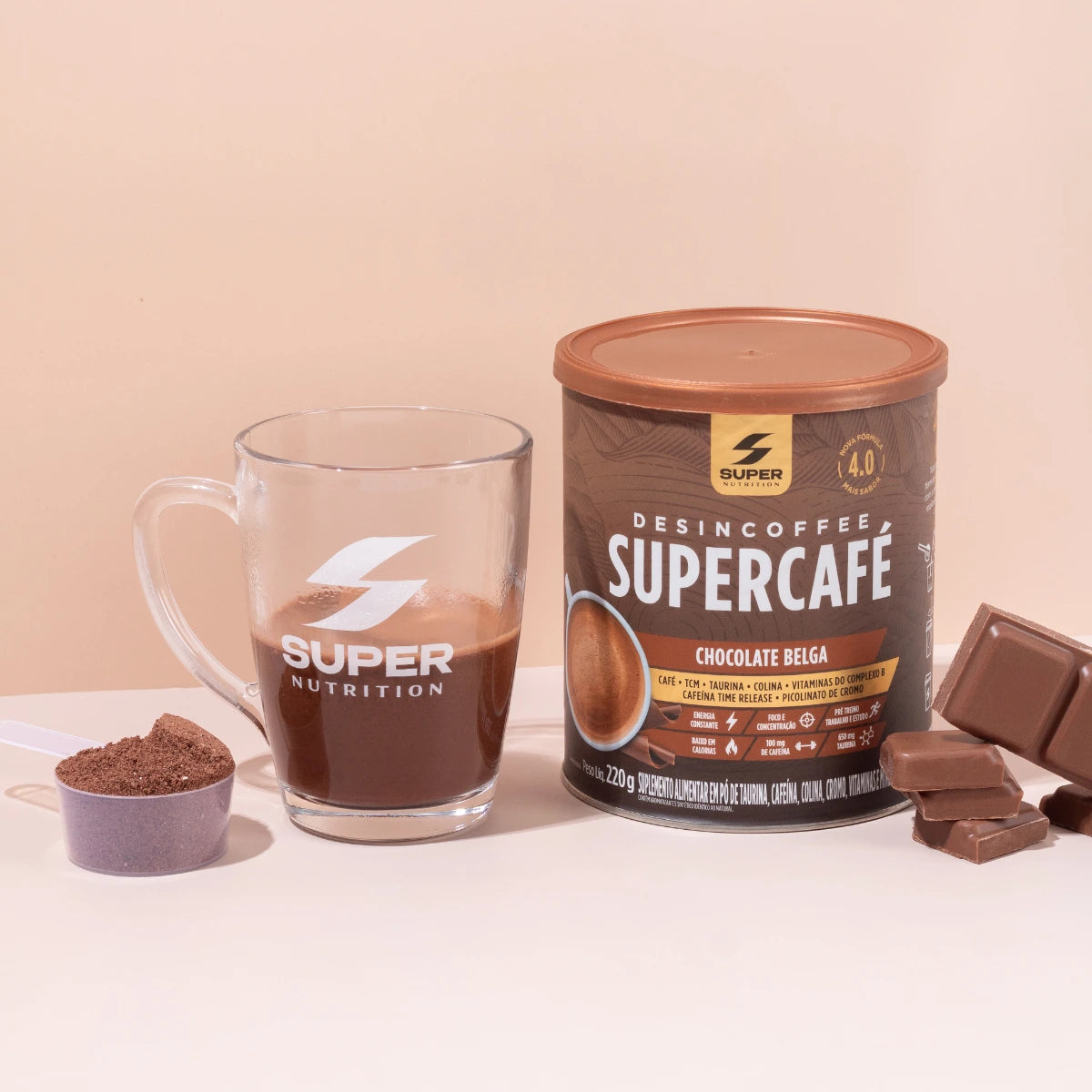 Desincoffee with a glass of coffee and chocolate pieces on a beige background