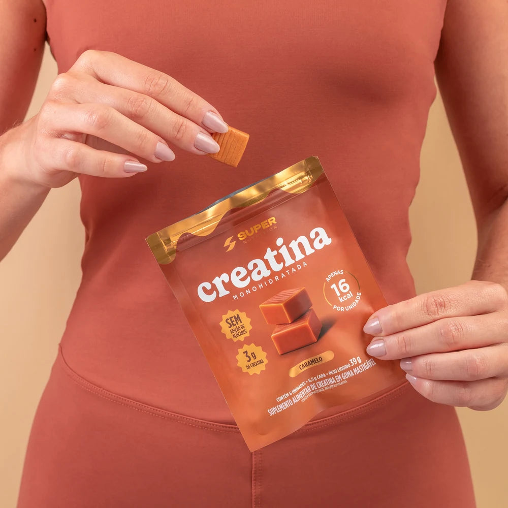 Taking a Caramel creatine bite from the travel pouch